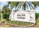 A beautifully landscaped sign welcomes residents to Bay Isle Landings at 5153 Bay Isle Cir, Clearwater, FL 33760