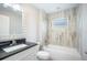 Updated bathroom with a tub and shower, vanity, and modern fixtures at 5319 Lantana St, Zephyrhills, FL 33542