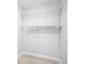 A walk-in closet has wall-mounted shelving for storage at 5319 Lantana St, Zephyrhills, FL 33542