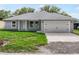 Charming home featuring well-manicured lawn, a two car garage, and white trim at 5319 Lantana St, Zephyrhills, FL 33542