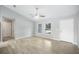 Bright living room with tile floors, a ceiling fan, and plenty of natural light at 5319 Lantana St, Zephyrhills, FL 33542