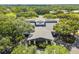 An aerial view of the community center building, revealing its unique architecture and surrounding lush greenery at 5813 Bent Grass Dr, Valrico, FL 33596