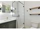 Modern bathroom boasting sleek glass shower, square sink with gold fixtures and vanity at 5813 Bent Grass Dr, Valrico, FL 33596
