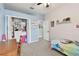 Spacious bedroom featuring a walk-in closet, desk and Stitch themed bed spread at 5813 Bent Grass Dr, Valrico, FL 33596