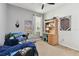Cozy bedroom featuring neutral walls, a desk with shelving, and a playful, themed decor creating a welcoming atmosphere at 5813 Bent Grass Dr, Valrico, FL 33596