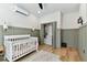 Bedroom featuring modern wainscoting, a closet, and modern decor at 5813 Bent Grass Dr, Valrico, FL 33596