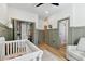 The Bedroom features modern wainscoting, custom cabinetry, and a nearby bathroom and closet at 5813 Bent Grass Dr, Valrico, FL 33596