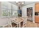 Dining area features hardwood floors, pantry, bar hutch and great natural light at 5813 Bent Grass Dr, Valrico, FL 33596
