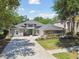Beautifully landscaped, single-story home featuring a concrete driveway, two-car garage, and a manicured front yard at 5813 Bent Grass Dr, Valrico, FL 33596