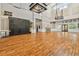Spacious hall with tall ceilings, wood floors, decorative lighting, and large windows at 5813 Bent Grass Dr, Valrico, FL 33596
