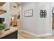 Hallway with wood laminate floors and decorative wall art and Gathering photos at 5813 Bent Grass Dr, Valrico, FL 33596