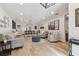 Bright, open-concept living room and dining area with hardwood floors and recessed lighting at 5813 Bent Grass Dr, Valrico, FL 33596