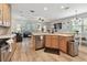 Open living space blends the kitchen and living room, featuring great flow and hardwood floors at 5813 Bent Grass Dr, Valrico, FL 33596
