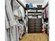 Well-organized walk-in closet featuring shelves, drawers, and hanging rods for maximum storage at 5813 Bent Grass Dr, Valrico, FL 33596