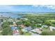 Breathtaking aerial view of a charming neighborhood with lush greenery and stunning waterfront scenery at 5871 Oakhurst Dr, Seminole, FL 33772