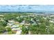 Stunning aerial view of lush neighborhood, showcasing homes and serene atmosphere at 5871 Oakhurst Dr, Seminole, FL 33772