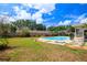 Backyard featuring an in-ground pool with patio at 5871 Oakhurst Dr, Seminole, FL 33772