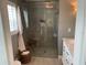 Beautifully updated bathroom featuring a glass-enclosed shower, stylish fixtures, and modern design at 5871 Oakhurst Dr, Seminole, FL 33772