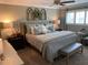 Comfortable bedroom with neutral tones, ceiling fan, and natural light from bright windows at 5871 Oakhurst Dr, Seminole, FL 33772