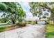 Charming one story home with a two car garage, palm trees and RV parking at 5871 Oakhurst Dr, Seminole, FL 33772