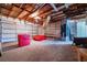 Spacious garage with an open ceiling, built-in shelving, and ample room for storage and vehicles at 5871 Oakhurst Dr, Seminole, FL 33772