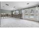 Bright living room with white trim and doors leading to the pool at 5871 Oakhurst Dr, Seminole, FL 33772