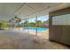 Covered patio offering a view of the pool and backyard at 5871 Oakhurst Dr, Seminole, FL 33772