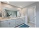 Bathroom features a double vanity, marble countertops, plenty of storage and great lighting at 6031 Grand Sonata Ave, Lutz, FL 33558