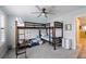 Spacious bunk bedroom featuring a ceiling fan and carpet offers a comfortable and functional space for to relax and play at 6031 Grand Sonata Ave, Lutz, FL 33558
