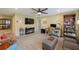 Spacious bonus room with comfortable seating, a ceiling fan, and built-in bookcase at 6031 Grand Sonata Ave, Lutz, FL 33558