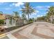 Welcoming entrance to Avila Point features a beautifully landscaped stone sign and gated entry for added security at 6031 Grand Sonata Ave, Lutz, FL 33558