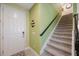 Inviting entryway with staircase, neutral color palette, and tiled flooring at 6031 Grand Sonata Ave, Lutz, FL 33558