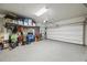 Spacious garage with epoxy flooring provides ample space for parking and storage, enhancing functionality and organization at 6031 Grand Sonata Ave, Lutz, FL 33558
