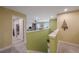 Upstairs hallway leading to a spacious bonus room and featuring a decorative wooden Christmas tree on the wall at 6031 Grand Sonata Ave, Lutz, FL 33558