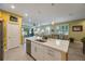 Open layout showcases the kitchen island and transitions into the dining and living spaces at 6031 Grand Sonata Ave, Lutz, FL 33558