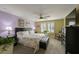 Main bedroom featuring natural light, soft colors, and a ceiling fan at 6031 Grand Sonata Ave, Lutz, FL 33558