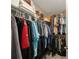 Efficient walk-in closet design maximizes storage with shelves and hanging rods for organized clothing and personal items at 6031 Grand Sonata Ave, Lutz, FL 33558
