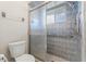 Bathroom featuring shower with glass door, updated fixtures, and a grab bar for accessibility at 6058 Waycross Dr, Spring Hill, FL 34606