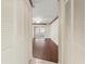 Bedroom hallway with hardwood flooring, closet and view to enclosed screened patio with outside access at 6058 Waycross Dr, Spring Hill, FL 34606