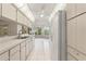 Modern kitchen with white cabinets, updated appliances, and bright natural lighting at 6058 Waycross Dr, Spring Hill, FL 34606