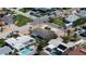 Aerial view of a coastal neighborhood offering beautiful homes, serene canals, and lush tropical landscaping at 6405 2Nd Palm Pt, St Pete Beach, FL 33706