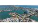Stunning aerial view showcases a waterfront community near the ocean, with city views at 6405 2Nd Palm Pt, St Pete Beach, FL 33706