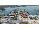 Aerial view of a charming waterfront community featuring stunning water views and lush landscaping at 6405 2Nd Palm Pt, St Pete Beach, FL 33706