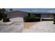 Inviting home features a spacious two-car garage and ample driveway parking at 6405 2Nd Palm Pt, St Pete Beach, FL 33706