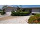 Charming home featuring an attached garage and well-maintained landscaping at 6405 2Nd Palm Pt, St Pete Beach, FL 33706