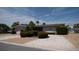 Charming single-story home with manicured hedges, shrubbery and a gravel yard at 6405 2Nd Palm Pt, St Pete Beach, FL 33706
