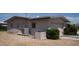 Rear view of a home, showcasing the outdoor AC unit and back entrance at 6405 2Nd Palm Pt, St Pete Beach, FL 33706