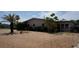 Charming side view shows a home with large windows and minimal lawn at 6405 2Nd Palm Pt, St Pete Beach, FL 33706