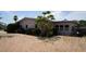 Charming exterior side view of a well maintained home with minimal lawn at 6405 2Nd Palm Pt, St Pete Beach, FL 33706