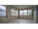 An airy sunroom with multiple windows and light walls offers bright natural light and views at 6405 2Nd Palm Pt, St Pete Beach, FL 33706